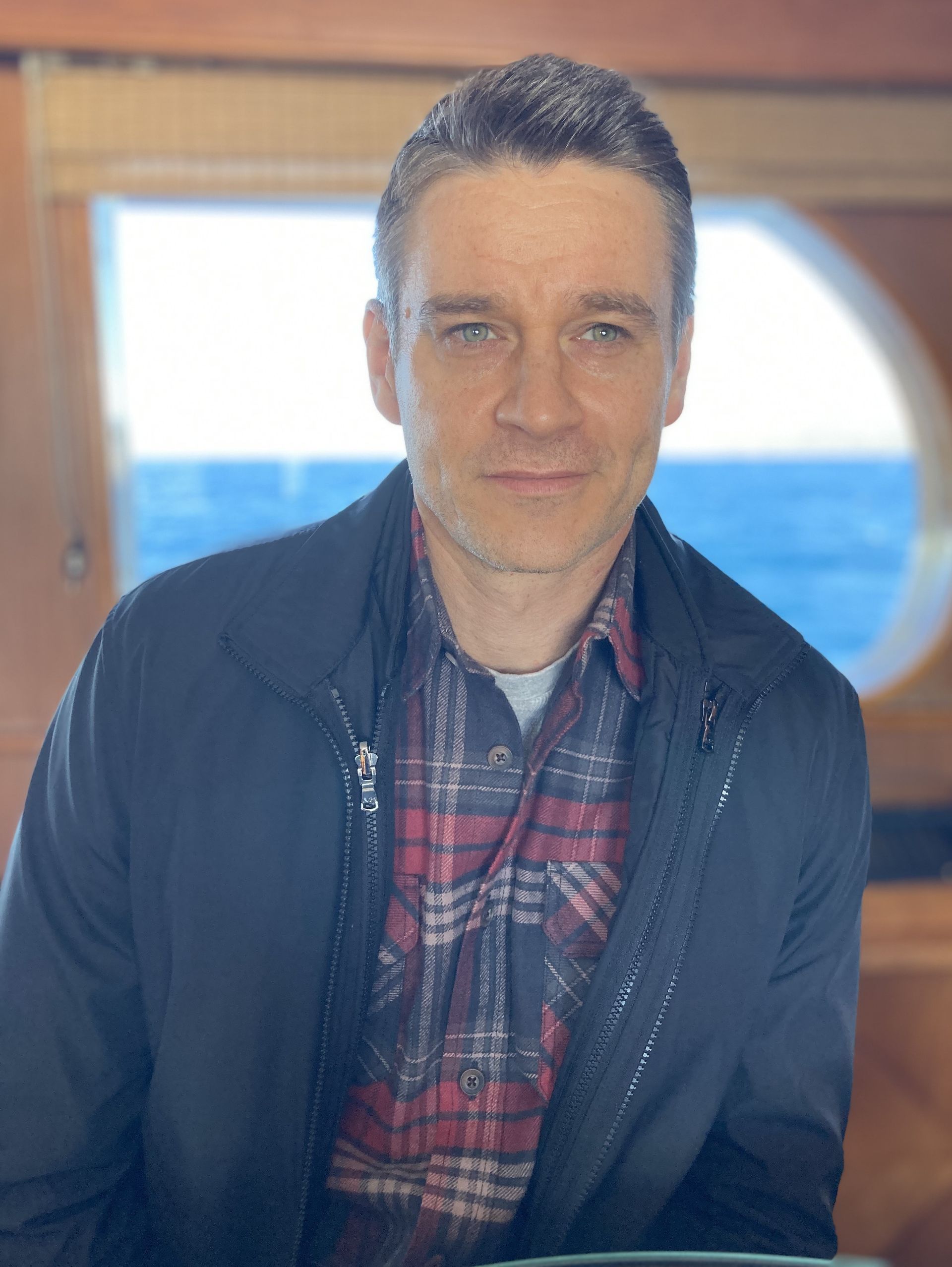 Clark Moore — on set, black jacket